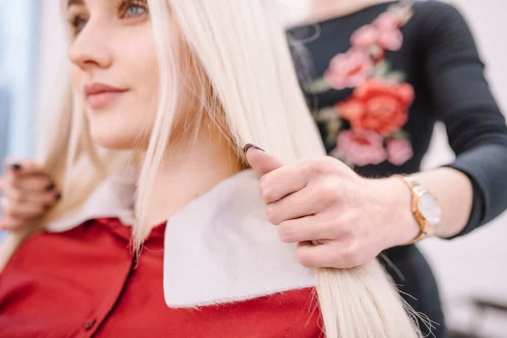 What Is A Versatile Sew In? 4 Evergreen Style! 1 close up hairdresser working with girl