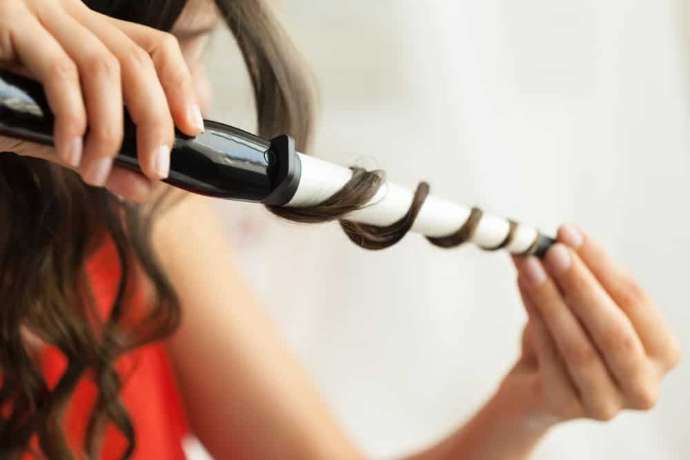 What Is A Versatile Sew In? 4 Evergreen Style! 2 hairstylist curling hair client hairdressing salon 1
