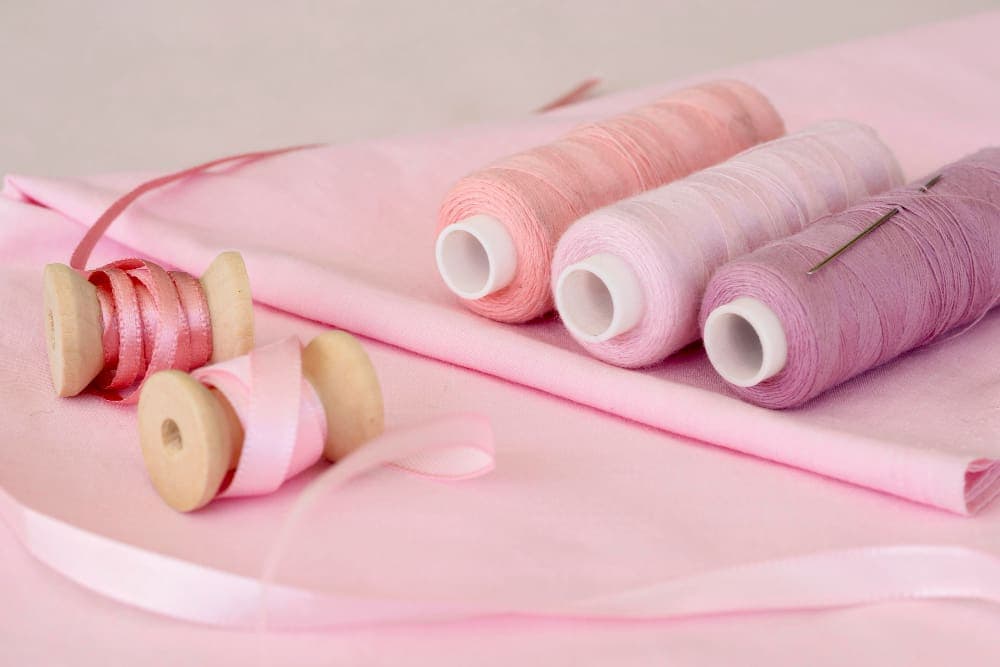 high angle pink thread rolls with fabric