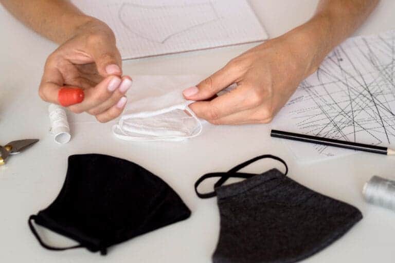 high angle woman sewing