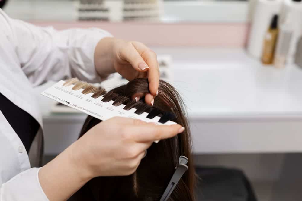 What Is A Versatile Sew In? 4 Evergreen Style! 4 woman getting treatment hairdresser shop