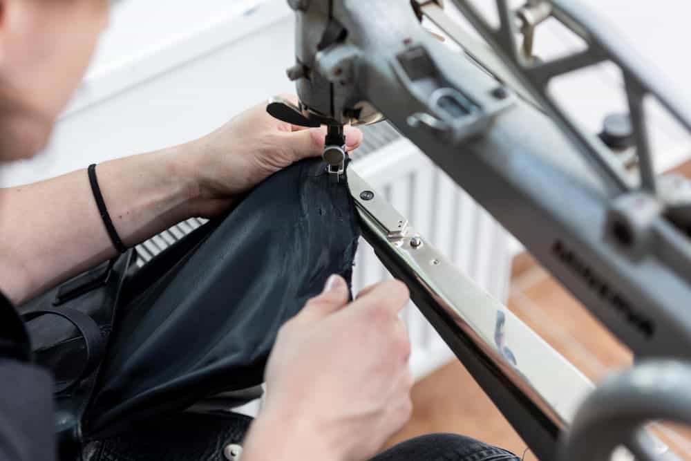 black leather bag repair tailoring studio leatherworking concept
