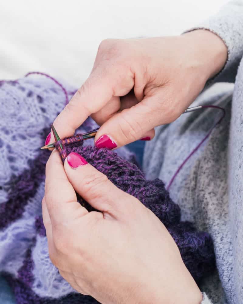 How To Sew On Fur Trim? A Complete Guide 3 close up woman s hand knitting purple wool