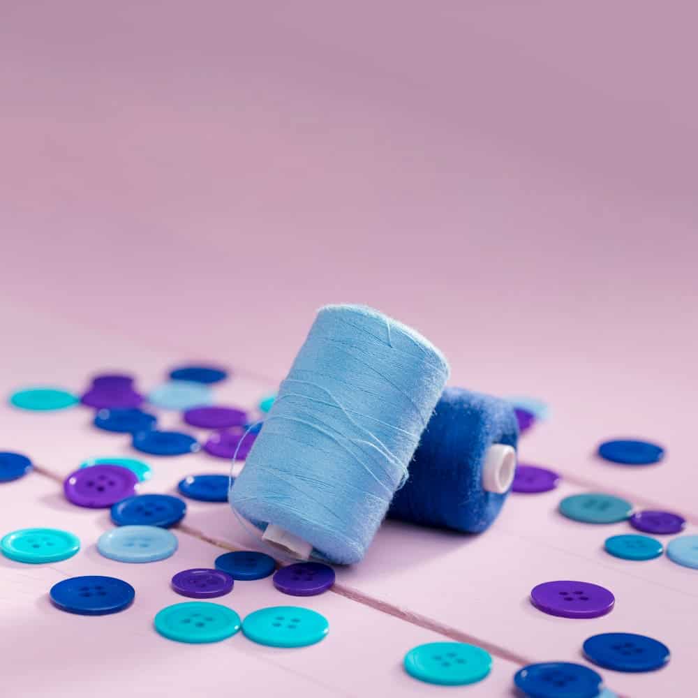 high angle blue buttons thread reels with copy space