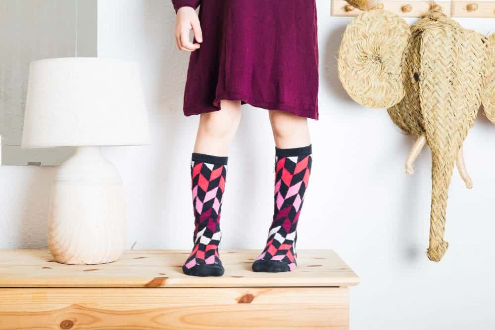 How To Sew Names On Stockings for Chritsmas 3 low section view girl standing tabletop