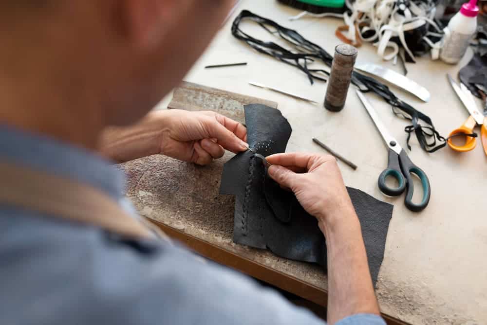 How To Sew Fake Fur With Ease? A Comprehensive Guide 2 man working alone leather workshop