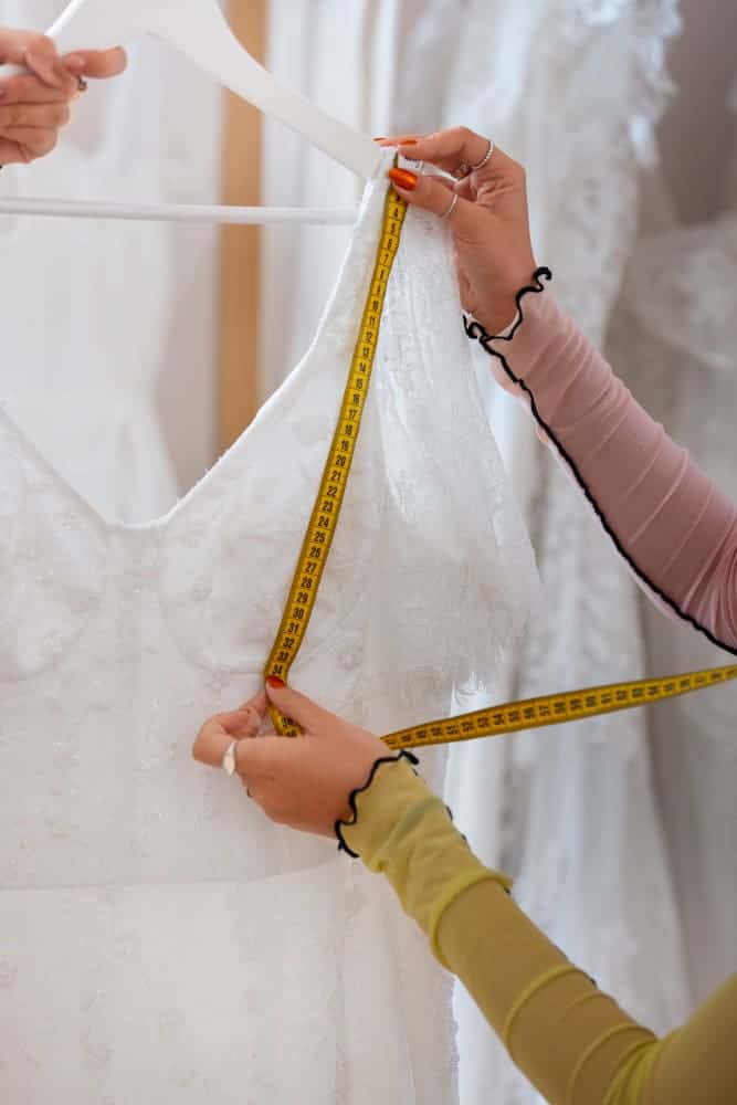 How To Sew Neckline While Keeping It Trendy And Compact 3 side view brazilian woman working as clothing designer