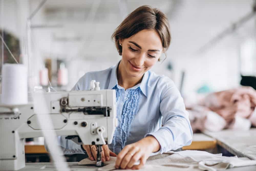 woman tailor working sewing factory